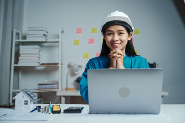 Female Industrial Engineers Look at Project Blueprints, measurements and drawing process of technical details on paper, International Labor Day Is 15 september a engineers day?