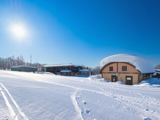 Facility building at the foot of a quiet ski resort at early morning on a clear day (Niseko Moiwa, Hokkaido, Japan)