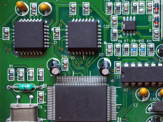 Square-shaped 28-pin programmable integrated circuits on PCB. Noname chips. 