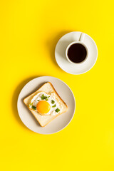 Fried eggs on toast bread with coffee - fast breakfast background