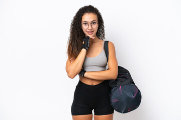 Young sport Arab woman with sport bag isolated on white background with glasses and smiling