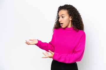 Young Arab woman isolated on white background with surprise expression while looking side