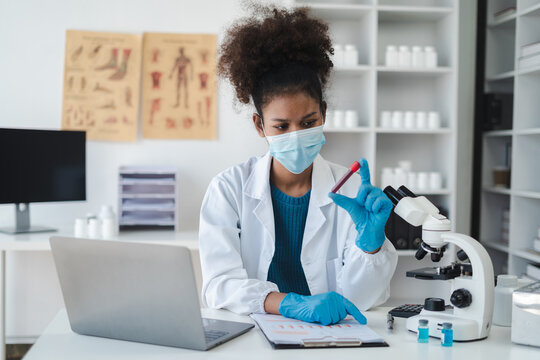 Scientist works with a pipette and a test tube. Scientific laboratory of biotechnology, development of medicine and research in chemistry, biochemistry and experiments