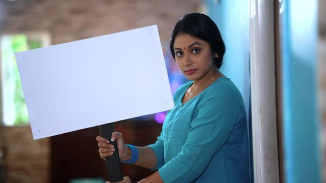 An Indian woman displays her message to the world, urging for equality, freedom, and unity. #Empowerment #VoiceOfChange"