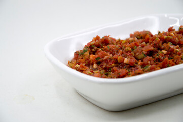 spicy turkish appetizer made with tomato, parsley and pepper