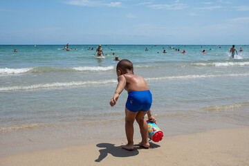 child playing on the beach