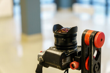 Wide-angle lens on the camera. Fisheye lens for shooting 360 panoramas and interior design in...