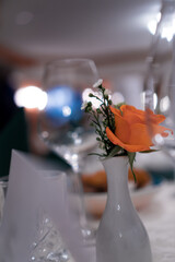 table setting with flowers, orange rose