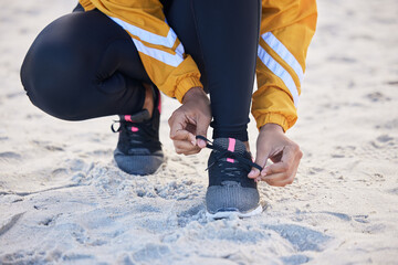 Beach, closeup and woman tie shoes for an outdoor run for fitness, health and wellness by seaside....