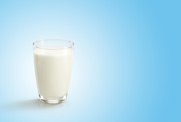 Glass of milk on blue white background