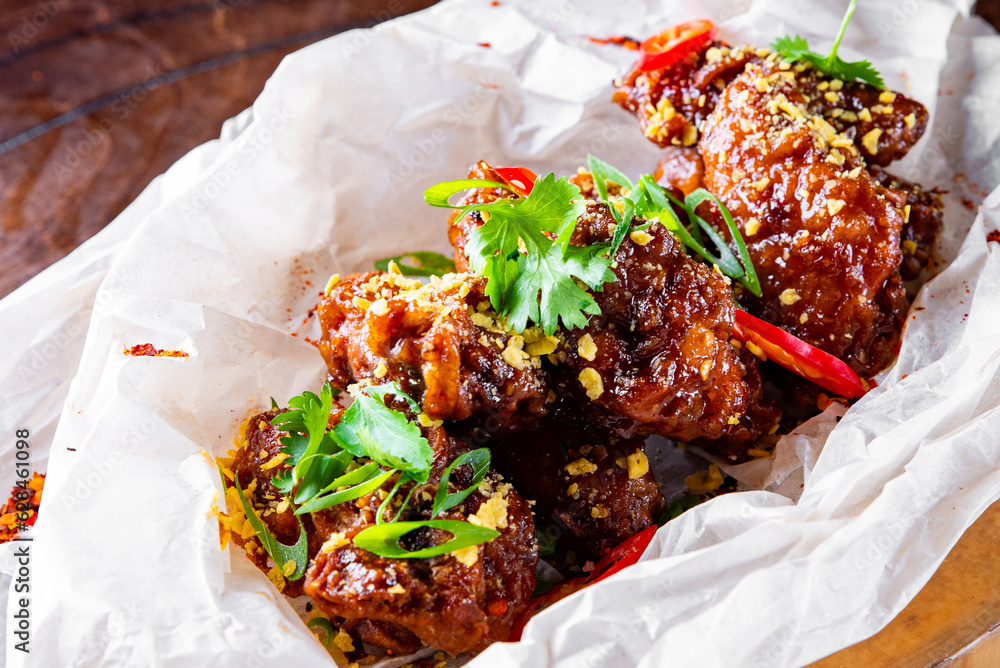 Poster fried bbq chicken wings in plate