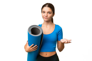 Teenager caucasian girl going to yoga classes while holding a mat over isolated background making doubts gesture while lifting the shoulders