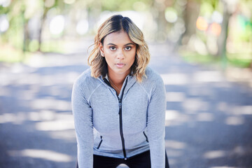 Runner woman, portrait and ready in park, mindset and exercise for fitness training in nature....