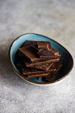 Pieces of different kinds of chocolate in bowl