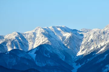 Papier Peint photo K2 K2. Sherpa. Mountain with snow and lake. Picturesque winter. Trees reflected in a calm alpine lake. Mountain. Tragedy on K2. A sherpa dies climbing K2. Climbers. Karakoram mountain range. Himalayas.
