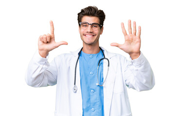 Young doctor man over isolated background counting seven with fingers