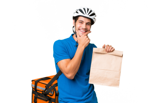 Young caucasian man taking a bag of takeaway food over isolated background happy and smiling