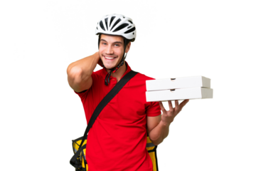 Pizza delivery man with work uniform picking up pizza boxes over isolated background laughing
