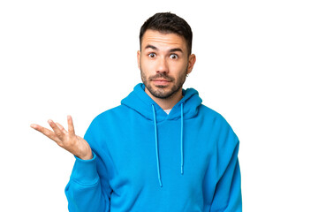 Young handsome caucasian man over isolated chroma key background making doubts gesture