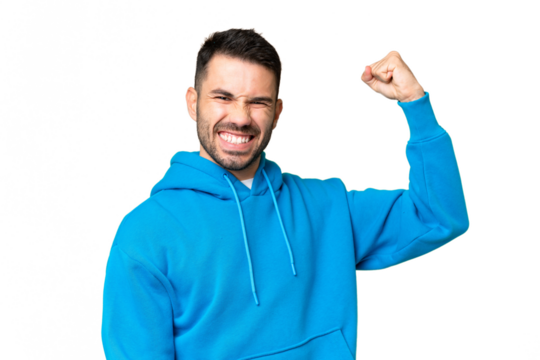 Young handsome caucasian man over isolated chroma key background doing strong gesture