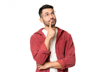 Young handsome caucasian man over isolated chroma key background having doubts while looking up