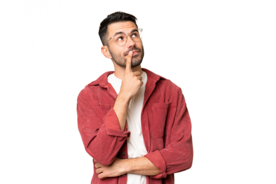 Young handsome caucasian man over isolated chroma key background having doubts while looking up