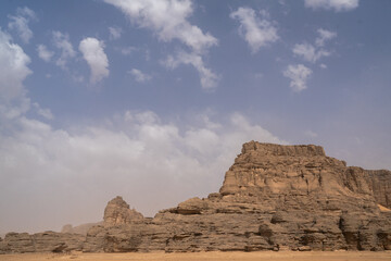 iew in the Sahara desert of Tadrart rouge tassili najer in Djanet City  ,Algeria.colorful orange sand, rocky mountains