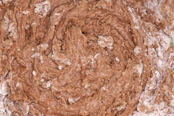 Textured chocolate raw dough used for baking purposes. ginger cookie dough