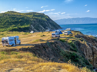 Caravans scattered on a cliff on the Adriatic Sea. Albania - 628470885