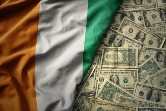 colorful waving national flag of cote divoire on a american dollar money background. finance concept