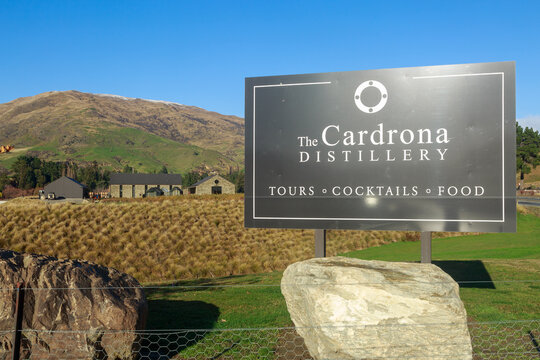 Sign outside the Cardrona Distillery, a manufacturer of gin and liqueurs in Cardrona, New Zealand. June 2 2023 