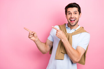 Photo of attractive surprised funky man wear tied jumper stylish polo t shirt point fingers empty...