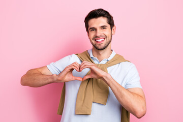 Portrait of positive satisfied person beaming smile hands fingers demonstrate heart symbol isolated on pink color background