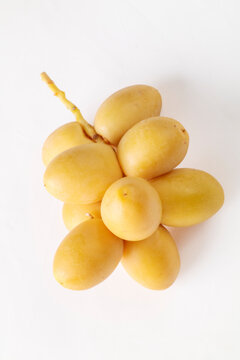 Yellow raw date palm isolated