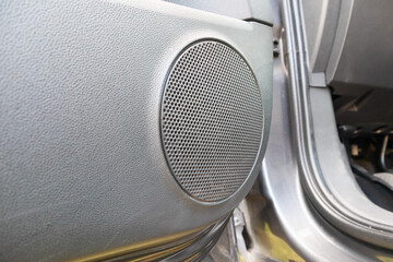 Car door. Image of a silver steel grill metal texture. Speaker grill texture.