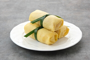 Semar Mendem, made from sticky rice with shredded chicken, wrapped in an omelette or crepe. Indonesian traditional food
