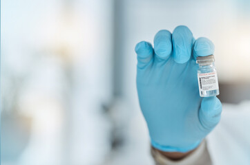 Vaccine, medicine and hand of a doctor with gloves for virus protection, health care and cure in...