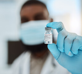 Medicine, vaccine and a hand of a doctor with gloves for virus protection, healthcare or cure in...