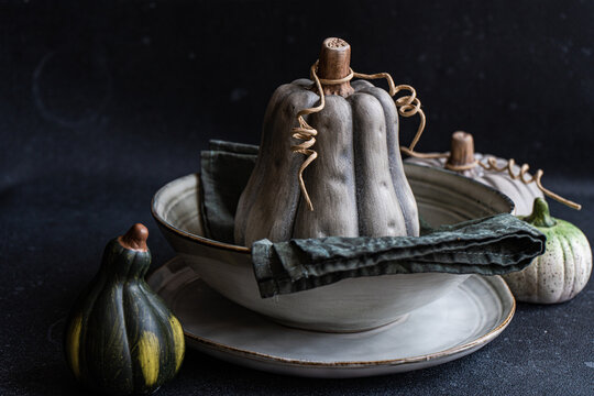 Autumnal table setting against dark background - Powered by Adobe