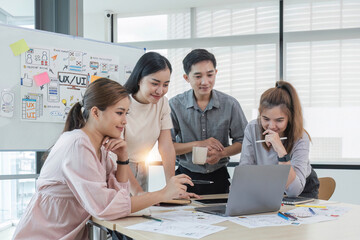 Asian office team brainstorming, plan for solution idea, Group of asia creative teamwork and woman leader at business meeting for developing mobile phone app, ux, ui start up, small business