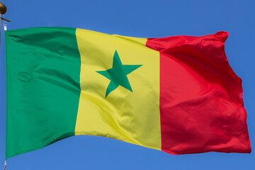 Senegal flag in the blue sky. horizontal panoramic banner. Close-up of waving the flag of Nigeria. Great photo for news illustrations.