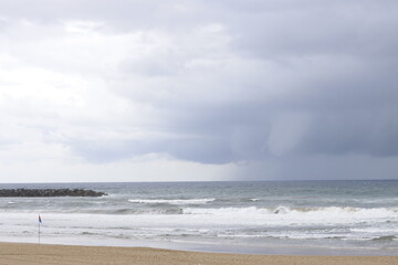 Fototapeta na wymiar Cloudy day by the shore of San Sebastian, Spain