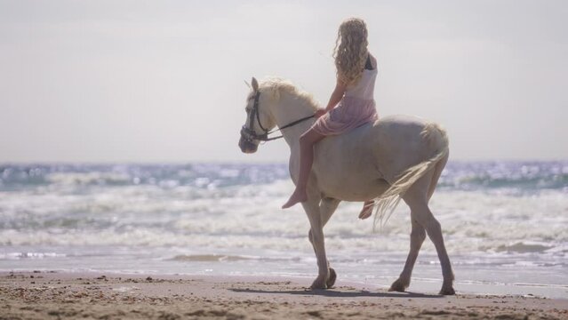 Girl On Unicorn Against Calm Beach Waves