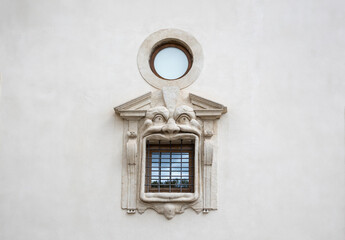 Detail of window in Mannerist Reinaissance style fasade. Palazzo Zuccari, Italy. Concept of travel, tourism and vacation in city.