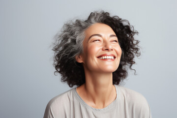A radiant mature woman expressing gratitude, her eyes sparkling with joy Generative AI