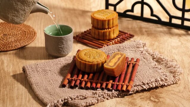 Mooncake Mid autumn festival ,with poured tea background