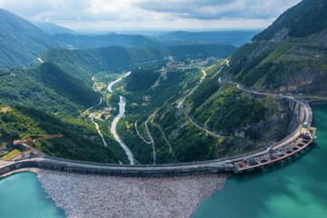 Inguri hydroelectric power plant in Georgia. Aerial view from drone of huge water dam. Hydropower...