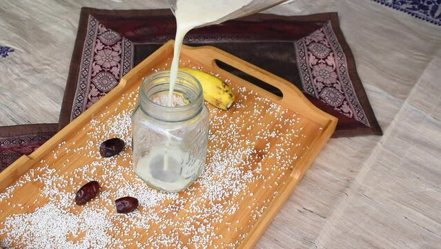 Healthy calcium rich Breakfast smoothie made with amaranth or ramdana and banana dates. No sugar shake for fast and healthy weight loss. selective focus on subject.