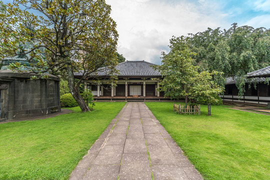 Yanaka, Tokyo, Japan - August 18, 2017 : Honden (Main Hall) of Tennoji Temple,  Tendai sect of Buddhism devoted to Bishamonten deity. Located in Taito Ward near  Yanaka Cemetery