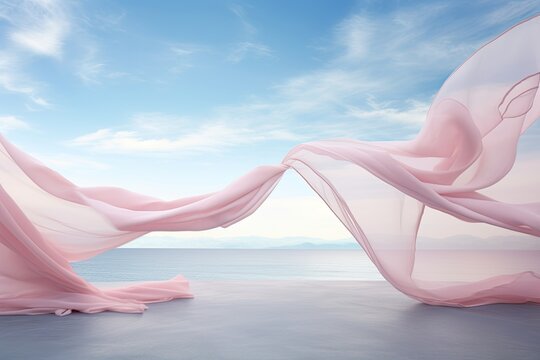 Silk fabric develops in the wind against the background of the sea and sky